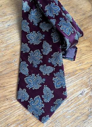 Краватка luca franzini for tie rack, італія, 100% шовк. бордовий колір та класичний візерунок пейслі. елегантний аксесуар.