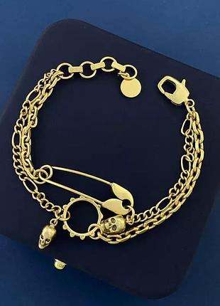 Ефектний позолочений браслет alexander mcqueen «gold safety pin&skulls» з шпилькою й черепами