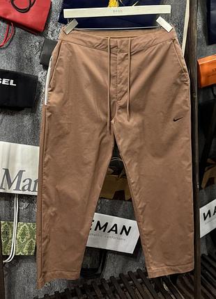 Штани чоловічі nike woven unlined sneaker pants нюдовий l m