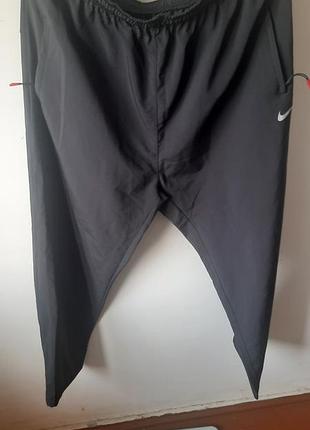 Спортивные штаны nike графитового цвета, размера 60