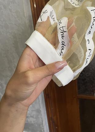 Жіноча блуза з написами, молочна