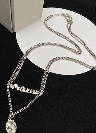 ​двухрядное колье-сотуар alexander mcqueen silver logo & crystal drop с логотипом и овальным кристалом люкс