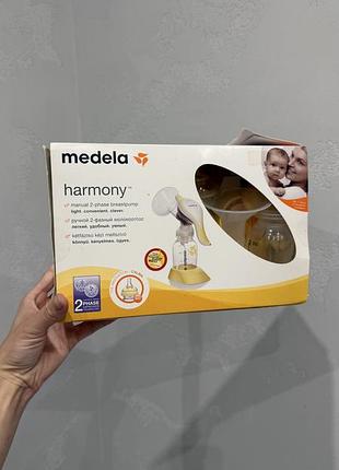 Молоковідсмоктувач medela harmony механічний
