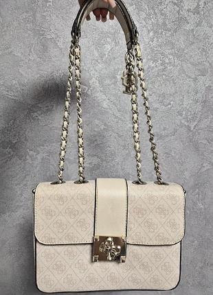 Сумка жіноча guess logo city convertible flap бежева