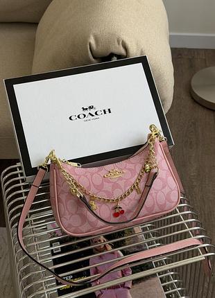 Сумка coach teri in signature canvas рожевий