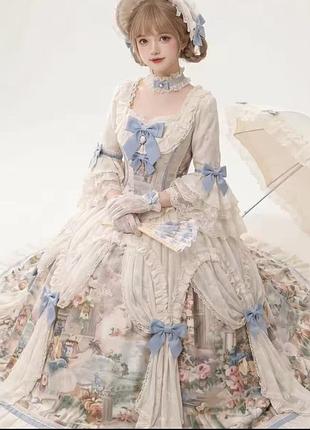 Романтичное платье в стиле лолиты rococo с голубыми бантами, кружевом и цветочным принтом
