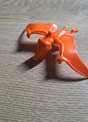 Іграшкова фігурка kinder динозавр помаранчевий пластик