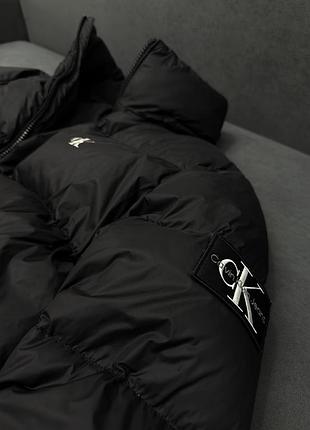 Черный пуховик calvin klein essentials down