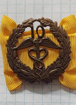 Бронзовий знак (клеймо у верхній частині)  торгової палати фінляндії (keskuskauppakamari), призначений для нагородження за 10 років сумлінної служби