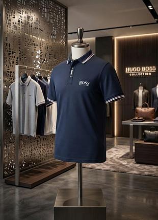 Чоловіча темно-синя футболко-поло hugo boss з білим логотипом та обідками