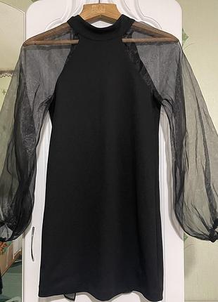 Коротка жіноча сукня міні чорна з бантом на спині та прозорими рукавами