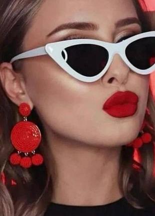 Сонцезахисні окуляри котяче око білі пластикові обідкові з чорними полікарбонатними лінзами та захистом від сонця