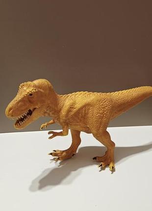 Коллекционная фигурка — золотой тираннозавр рекс от бренда schleich, шарнирная челюсть