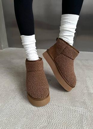 Ugg ultra mini platform teddy ginger
☺️матеріал:замша, хутро, водовідштовхувальна пропитка 💦
☺️виробник: china 🇨🇳 
☺️розміри: 37-41
 ціна: 2999 грн 6