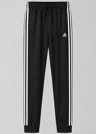 Жіночі спортивні штани adidas чорні з білими смужками