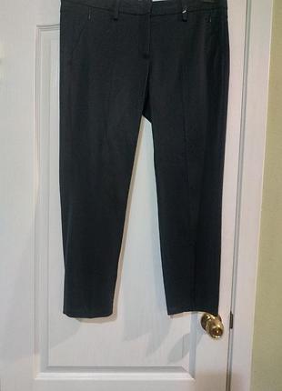 Новые,люксовые ,черные брюки с карманами спереди на змейках,сзади накладные. немецкий бренд  luisa cerano.. размер usa 12.