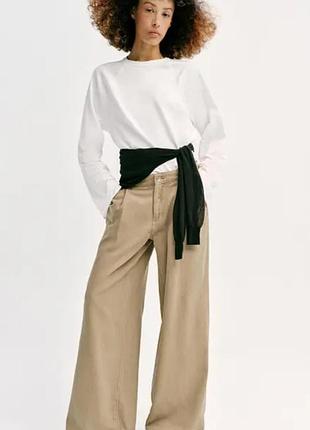 Штани широкі бежеві зі защипами zara