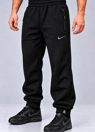 Чоловічі зимові спортивні штани nike acg темно сині теплі тринитка на байці манжет