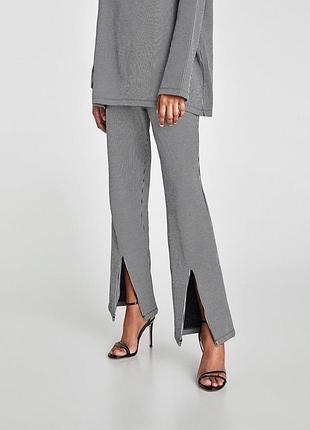 Жіночі брюки в смужку з розрізами zara