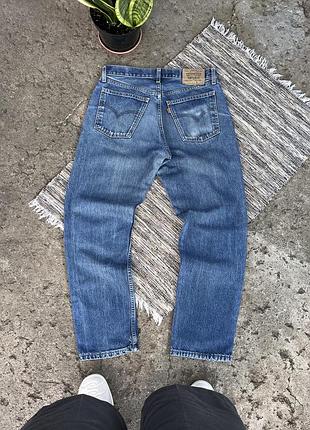 Вінтажні сині джинси levis 618 з помаранчевим логотипом в потертому стилі