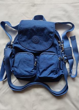 Фірмовий гакзак-сумка kipling firefly up true blue (511) k12887_511
невеликий компактний стильний текстильний рюкзак синього кольору 
22/31/14