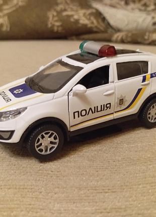 Іграшкова машинка - поліцейська машина kia sportage r