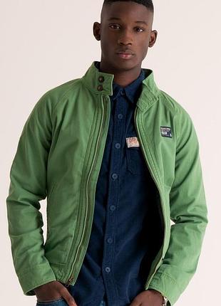 Зелена легка куртка від бренду superdry серії superdry commodity edition (зокрема, варіаціям harrington 💯 котон