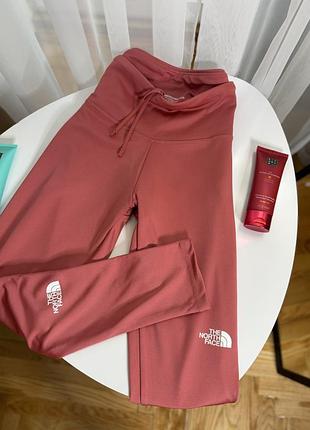 Оранжеві спортивні лосини the north face