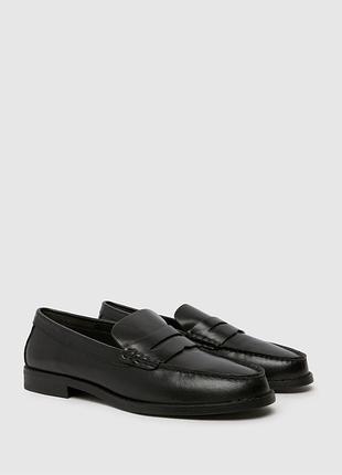 Класичні чорні шкіряні лофери (пенні-лофери) від бренду schuh