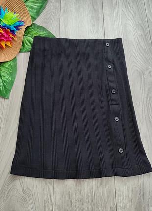 Чорна трикотажна мініспідниця в рубчик calvin klein jeans badge rib elongated skirt розмір s
