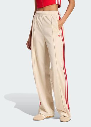 Спортивні штани жіночі adidas firebird loose tracksuit pants бежеві з червоними смужками