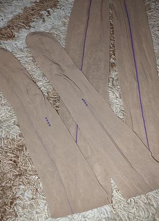 Жіночі бежеві капронові колготки з фіолетовою стрілкою спереду wolford