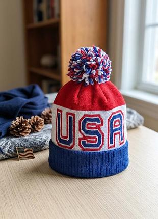 Зимова шапка usa з помпоном . тепла шапка біні сша