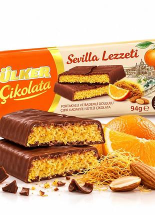 Шоколад молочный ülker sevilla lezzeti с апельсиново-миндальной начинкой и хрустящим кадаифом, 94 г, турция