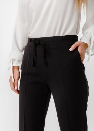 Женские брюки со шнурком и карманами2 фото
