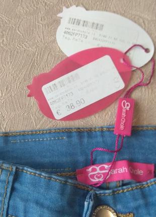 Рванные джинсы с розовым гипюром4 фото