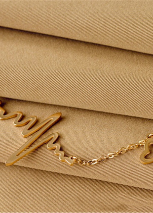 Жіночий ланцюжок з підвіскою довга ланцюжок золотого кольору у формі серцебиття3 фото