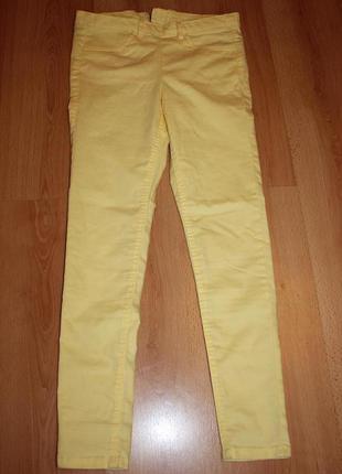 Ярко желтые джинсы с молнией сзади