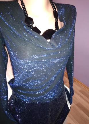 Супер стильная люрекс блузка хамелеон,темно синяя,новая.,с красивой спиной.