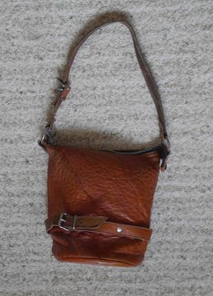 Сумка шкіряна висота -24 см діаметр-14 см ручка максимально 57 см