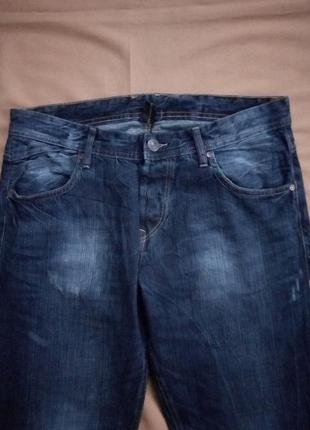 Темно-сині джинси з потертостями,2 фото