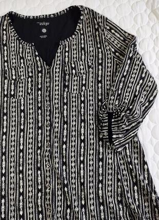 Чёрно-белая блузка на пуговицах,с карманами в орнамент от indigo4 фото