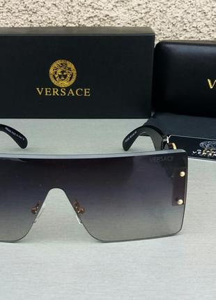 Очки в стиле versace  маска женские солнцезащитные черные с золотым логотипом2 фото