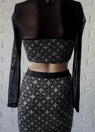 Шикарний топовий костюмчик, блискучий.