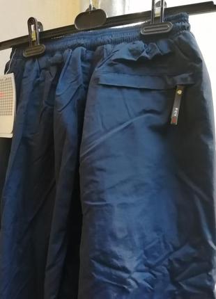 Спортивні зимові штани nike утеплені брюки карго водовідштовхуюча тканина5 фото