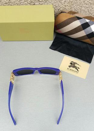 Burberry стильные узкие женские солнцезащитные очки синие с золотым логотипом4 фото