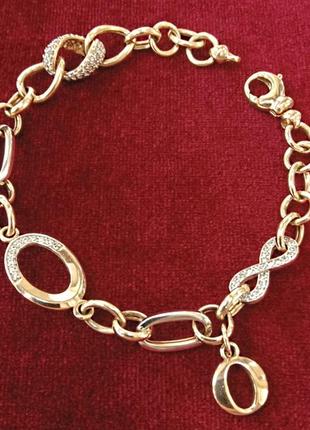 Золотой декоративный женский браслет с подвеской буква о и вставками фианитов1 фото