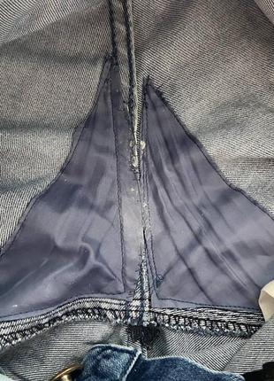 Жіночі блакитні джинсі з заниженою талією та потертостями8 фото
