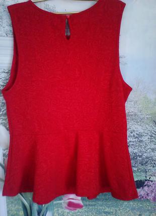 Яскрава червона блузка з баскою,фактурна тканина, р 164 фото