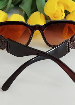 Солнцезащитные очки в коричневом цвете3 фото